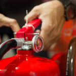 engineers-are-pull-safety-pin-fire-extinguishers_101448-1239